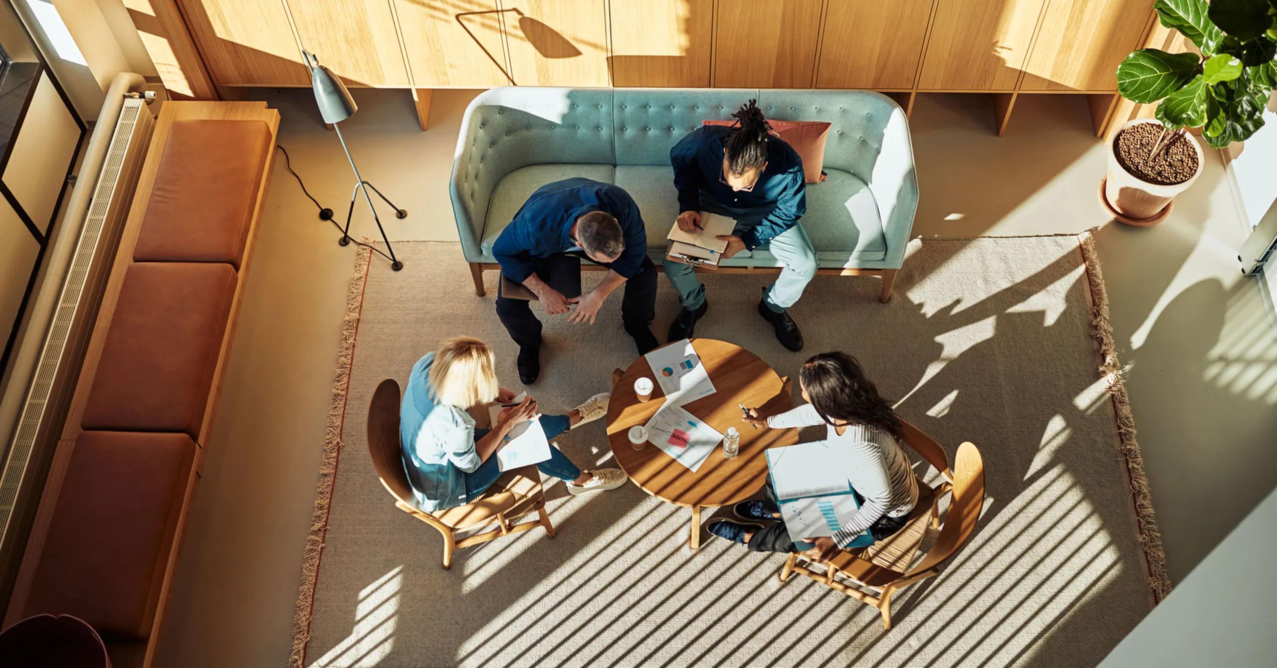 People sat around a table from above