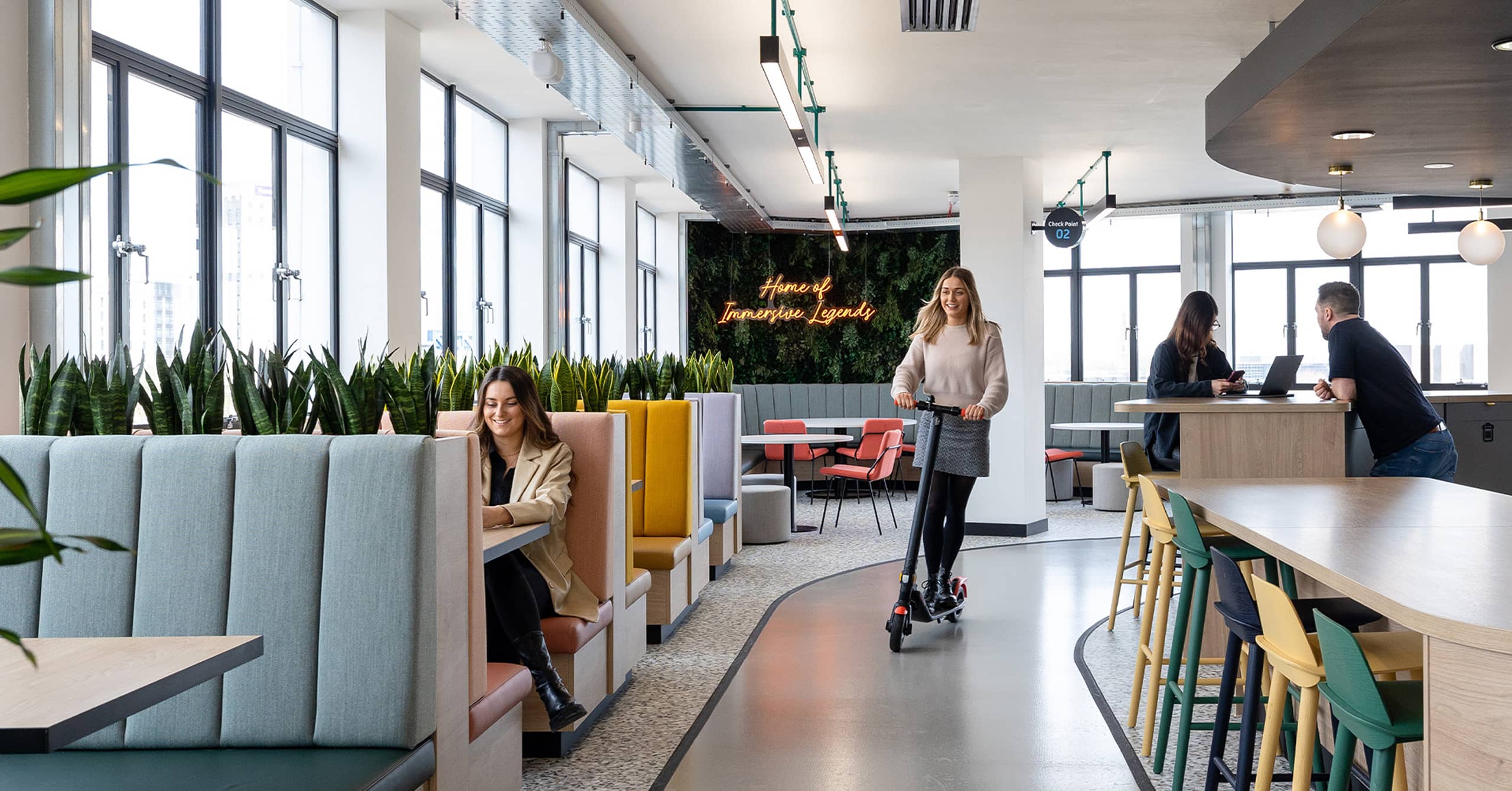 Employee on a scooter in an Interaction designed office