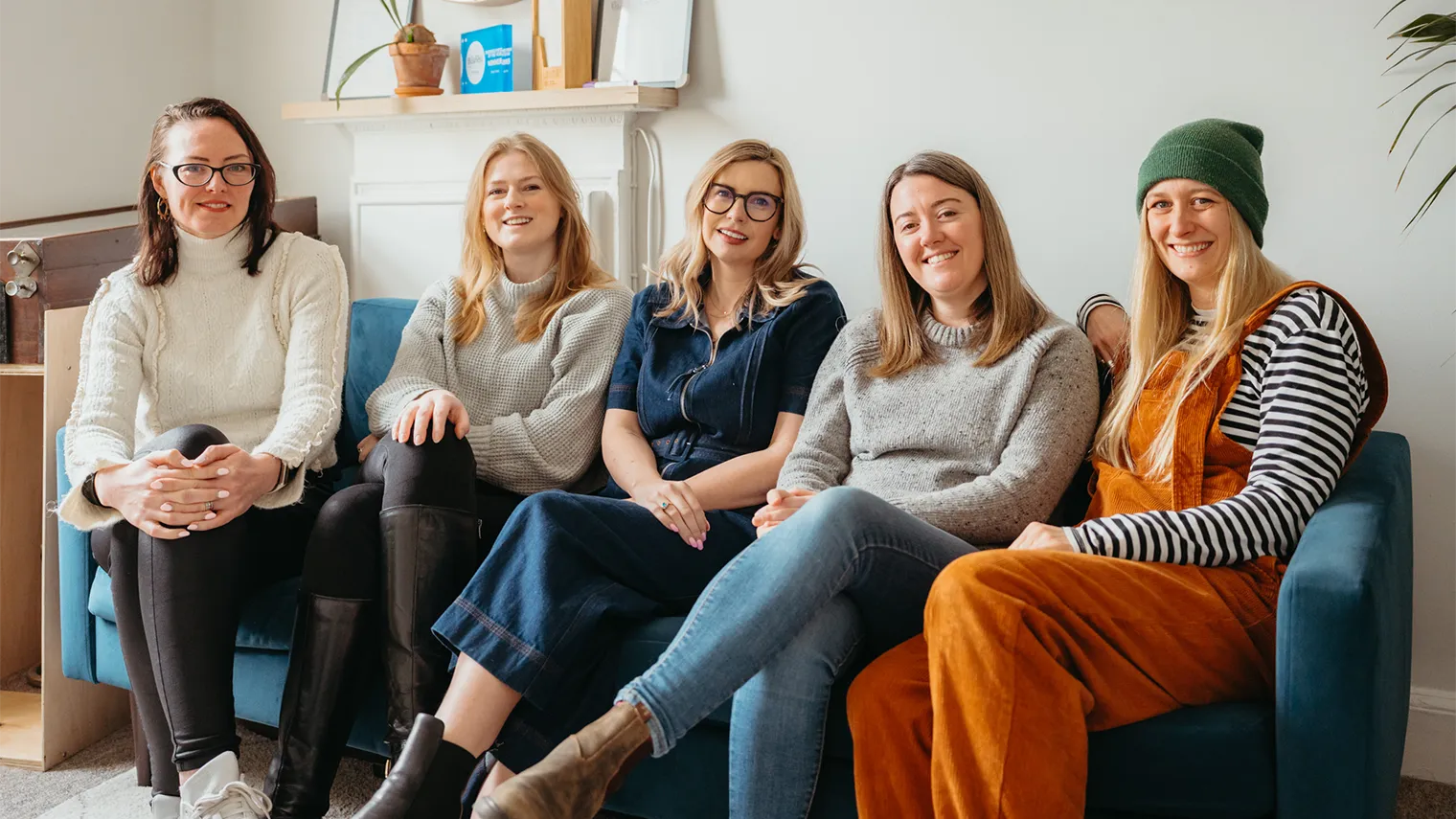 Some of the team at Storm sitting on a sofa