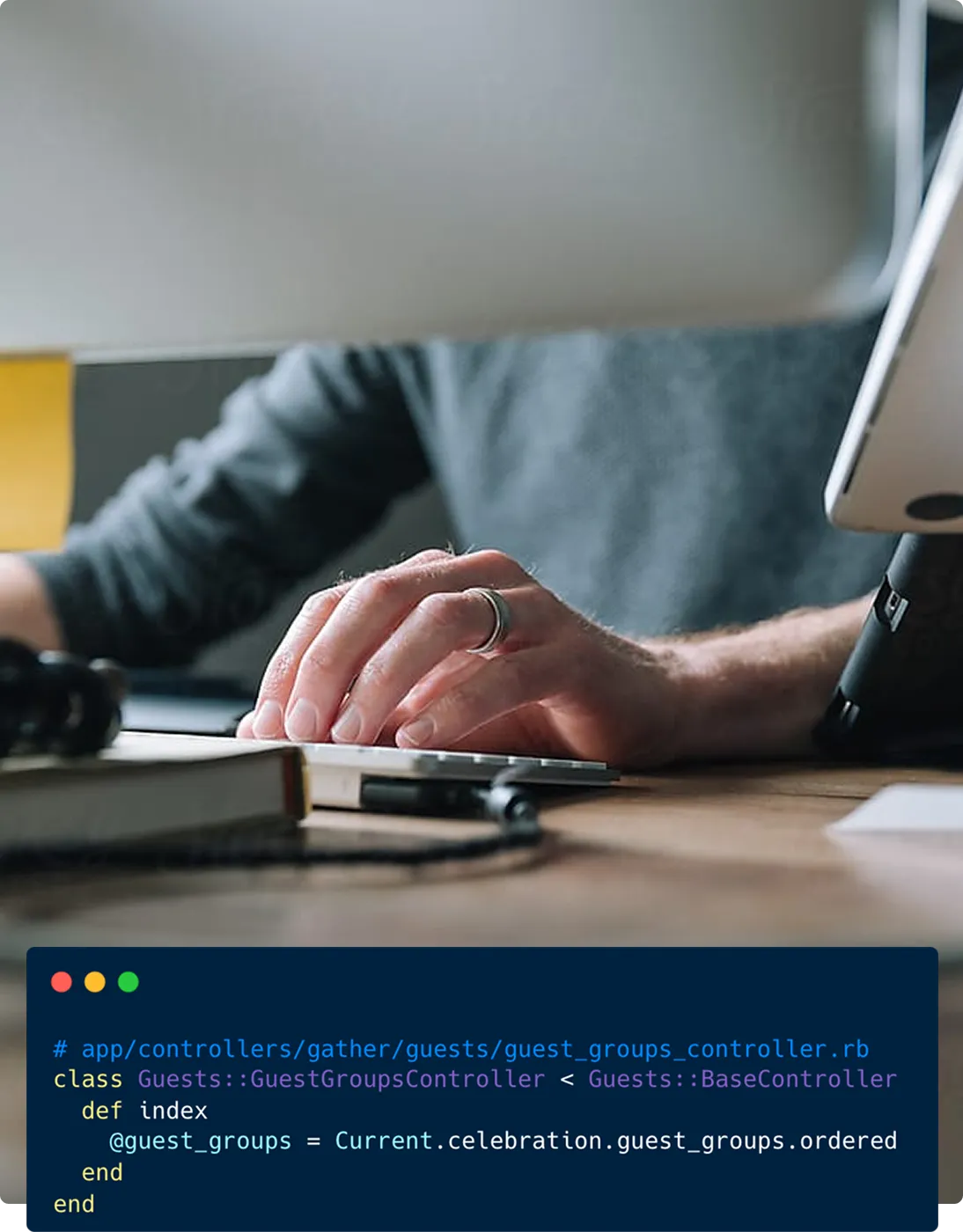 Image of someone sat at a computer, typing on a keyboard. Ruby code is visible in a panel below.
